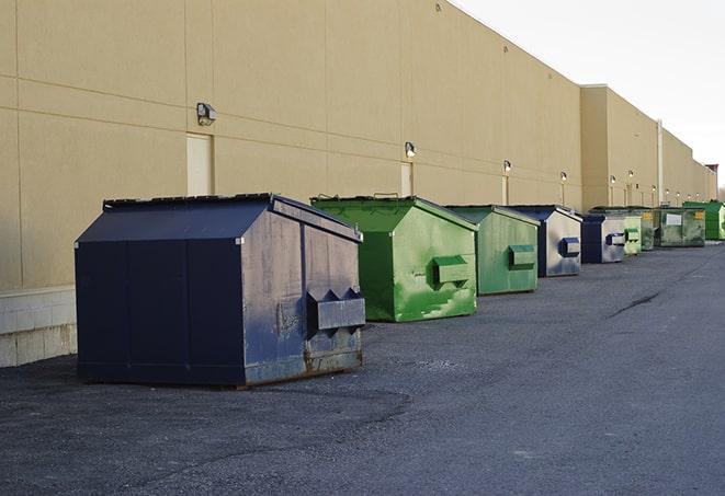 brightly colored dumpsters filled with construction waste in Hidden Hills, CA